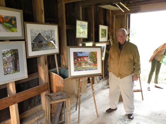 Tom McCobb with some of his paintings
