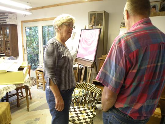 Marilyn Fegan with her painted pieces in her studio