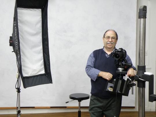A photograph of the photographer, Gene Gissin, in his studio
