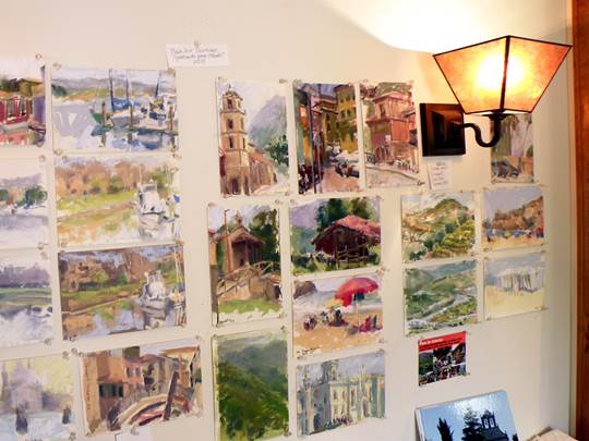 The wall of daily paintings at Mary Padgett's studio