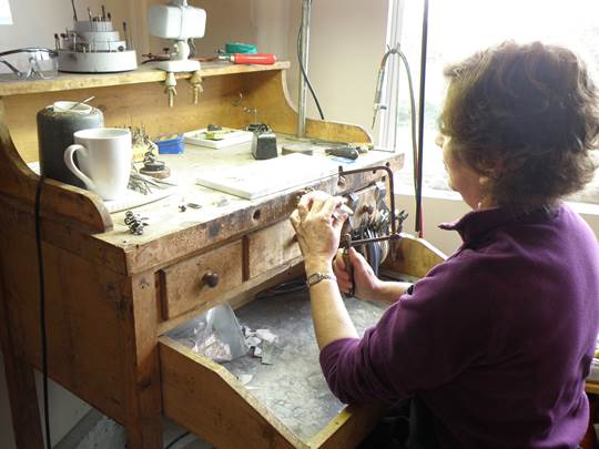 Susan Machamer demonstrating her jewelry making skills