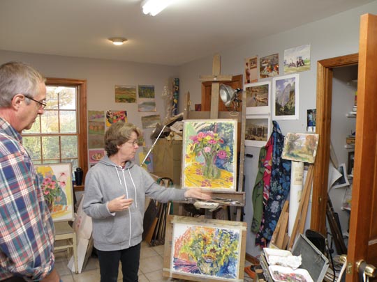 Mary Padgett discussing one of her paintings