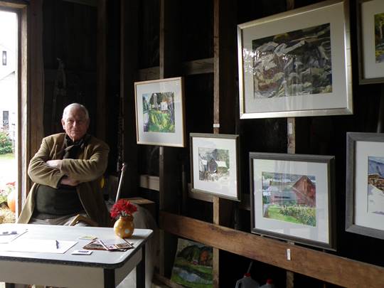 Tom McCobb with his paintings