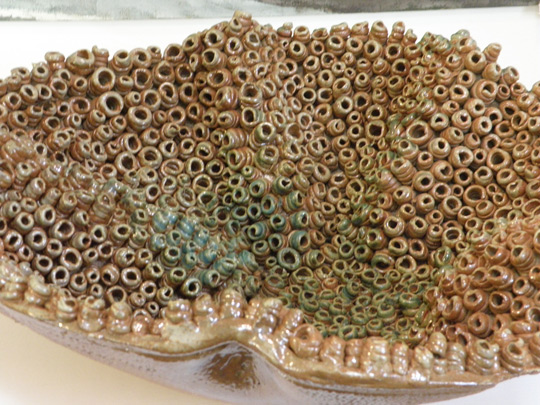 Highly textured ceramic sculpture by Naomi DeMuth
