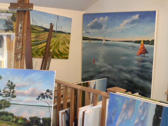 Paintings at various stages in Deb Wester's studio
