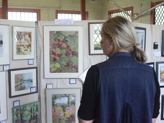 Viewing pieces by members of Cazenovia Area Painters in Carpenter's Barn