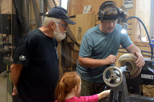 Neal Parker shared his wood-turning skills with hikers of the Art Trail.
