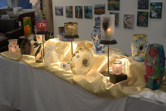 Elegant candle lanterns by Joyce Backus create their own dramatic lighting.