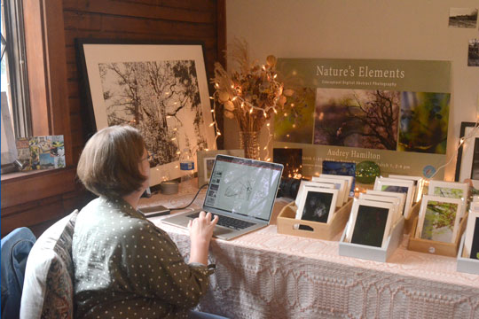 Audrey Hamilton working on her photography at her Carpenter's Barn studio space