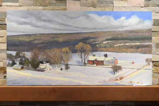 A snowscape by Tami Louco graces her mantle.